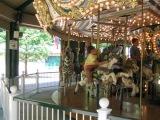 our girls riding the Merry-Go-Round