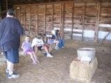 troop members planting bean seeds to take home